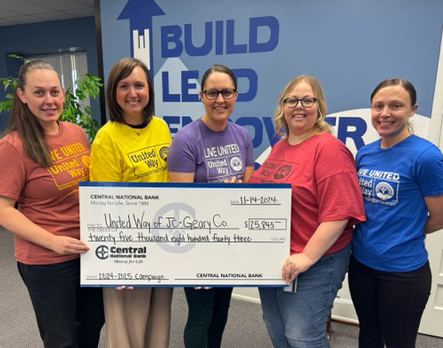 bank employees presenting large check to the United Way committee